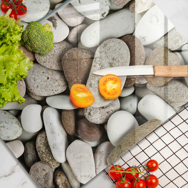 Skleněná krájecí deska Malé kameny pozadí