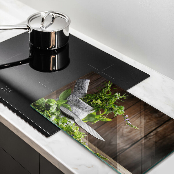 Skleněná deska do kuchyně Pěstuje bylinky a dřevo