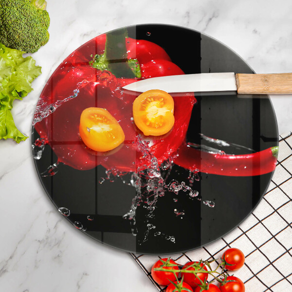 Skleněná deska do kuchyně Červené papriky ve vodě