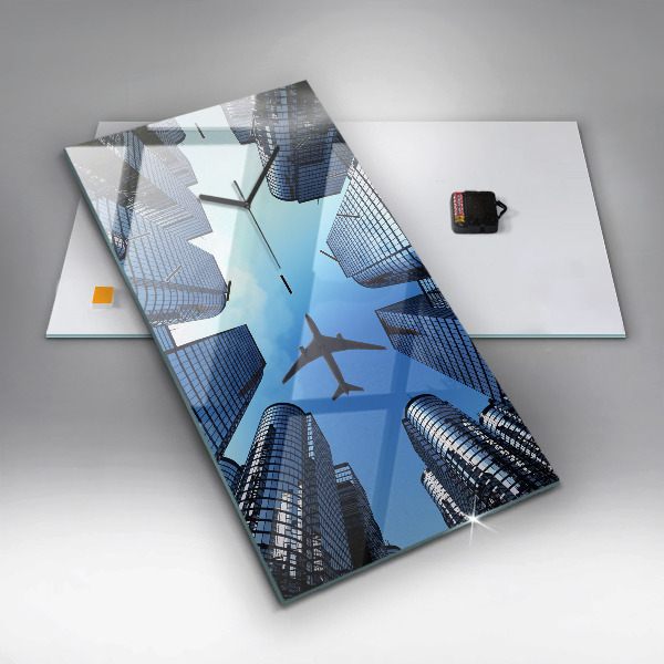 Vertikální skleněné hodiny Letadlo nad budovami