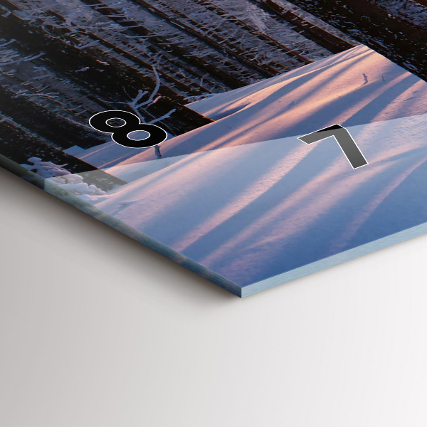 Horizontální hodiny na skle Les při západu slunce