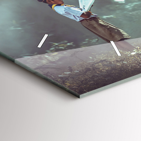 Horizontální skleněné hodiny na stěnu Chlapec si čte knihu