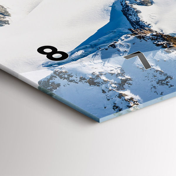 Horizontální hodiny na skle Lyžař v Alpách