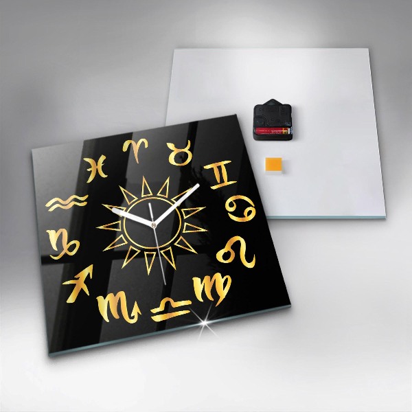 Skleněné nástěnné hodiny Zlatá astrologická znamení na černém pozadí.