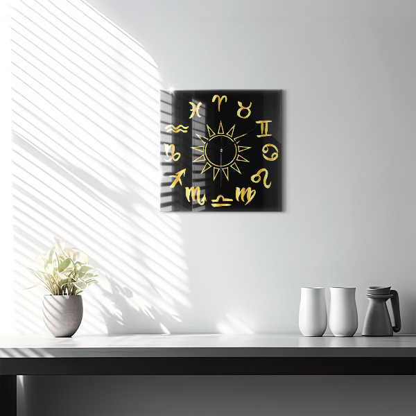 Skleněné nástěnné hodiny Zlatá astrologická znamení na černém pozadí.