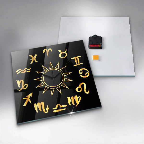Skleněné nástěnné hodiny Zlatá astrologická znamení na černém pozadí.